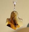 Thor's Hammer Pendant Made of Amber With Bits of Flora