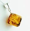 Faceted Amber Cube Pendant Made of Cognac Baltic Amber