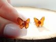 Small Carved Amber Butterfly Stud Earrings Made of Cognac Baltic Amber