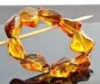 Amber Bracelet Made of Natural Shape Light Cognac Color Amber Rocks