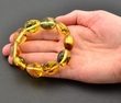 Amber Bracelet Made of Large Oval Amber Beads With Bits of Flora