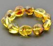 Amber Bracelet Made of Large Oval Amber Beads With Bits of Flora