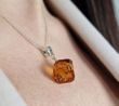 Faceted Amber Cube Pendant Made of Cognac Baltic Amber
