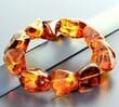 Large Amber Bracelet Made of Natural Shape Cognac Color Amber Rocks