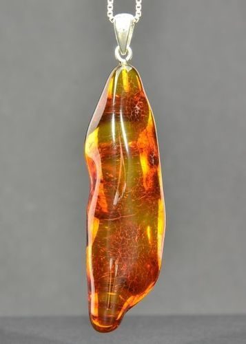 Amber Amulet Pendant Made of Tall Free Form Cognac Baltic Amber