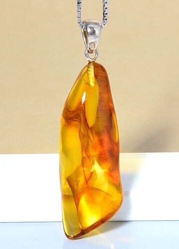 Amber Amulet Made of Natural Shape Honey Color Amber Rock