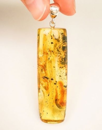 Amber Pendant Made of Tall Tube Shape Amber With Bits of Flora