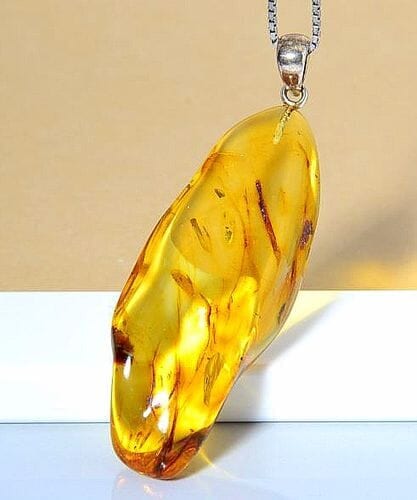 Amber Amulet Made of Tall Natural Shape Honey Color Amber Rock