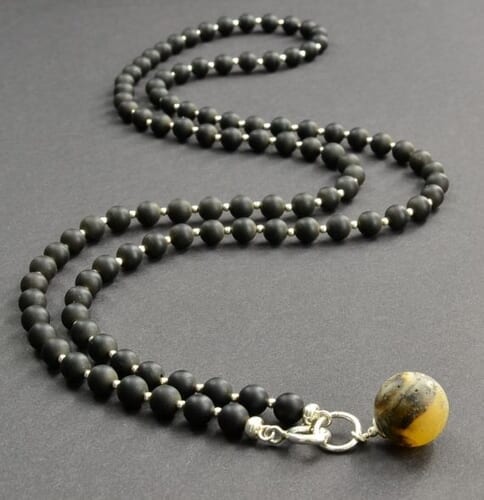 Amber Pendant Necklace Adorned with Sterling Silver Spacers