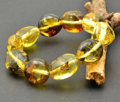 Amber Bracelet Made of Large Oval Amber Beads With Bits of Flora