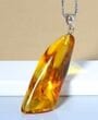 Amber Amulet Made of Natural Shape Honey Color Amber Rock