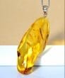 Amber Amulet Made of Tall Natural Shape Honey Color Amber Rock