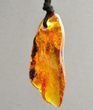 Large Amber Amulet On Black Cord