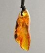 Large Amber Amulet Pendant On Black Cord