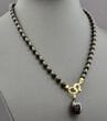 Dark Cherry Amber Pendant Necklace Adorned with Gold Plated Silver