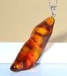 Amber Amulet Made of Tall Natural Shape Cognac Color Amber Rock