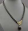 Dark Cherry Amber Pendant Necklace Adorned with Gold Plated Silver