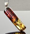 Amber Pendant Made of Tube Shape Colorful Baltic Amber