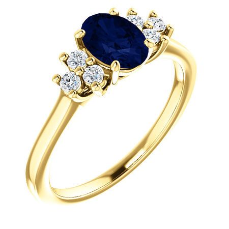 14 Karat Yellow Gold Blue Sapphire  & 0.20 Carat Diamond Ring